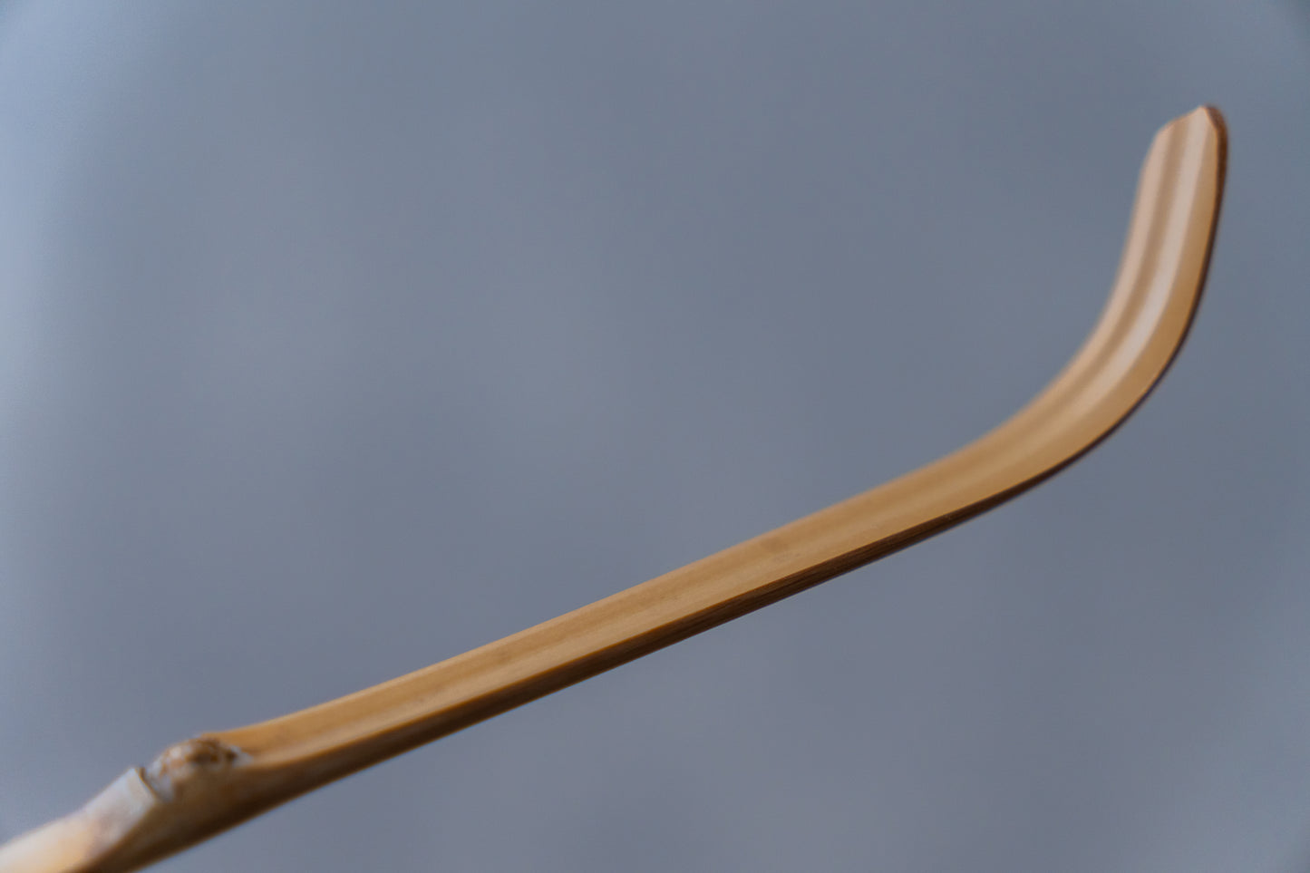 Emptea Katana Smoked Bamboo Scoop with a traditional tea chest (Chashaku 刀)