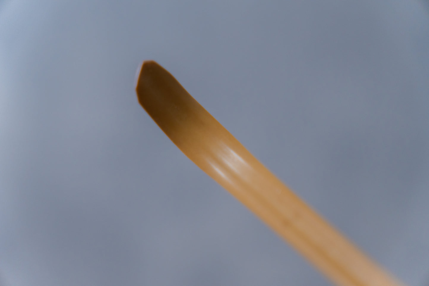 Emptea Katana Smoked Bamboo Scoop with a traditional tea chest (Chashaku 刀)